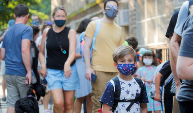 A child wears a face mask on the first day of New York City schools
